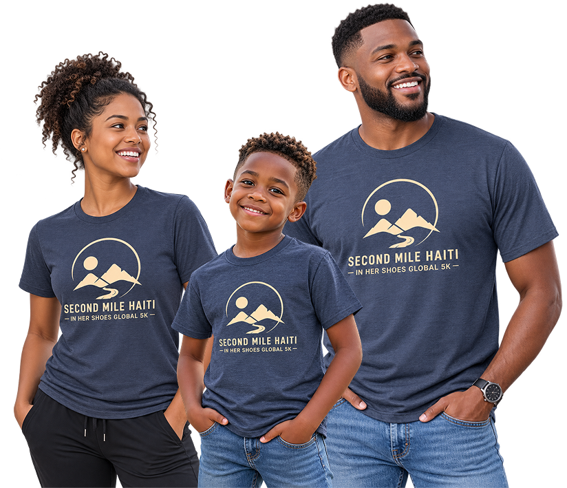 Three people wearing matching navy blue t-shirts with cream colored 'SECOND MILE HAITI - IN HER SHOES GLOBAL 5K' graphic, posed against a solid white background.